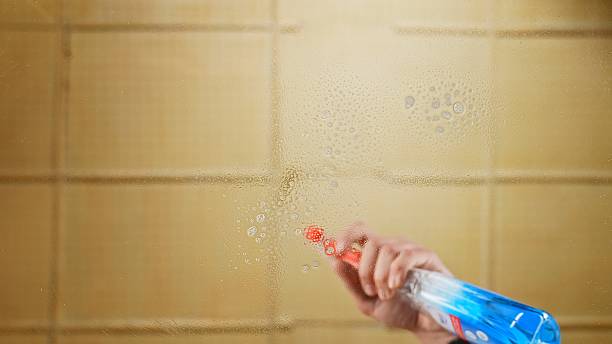 istock Efficient Glass Cleaning with Spray Bottle in Bathroom 2218127350
