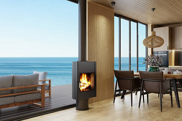 istock Cozy Scandinavian Oak Kitchen with Dining Area, Fireplace, and Ocean View 2218128933