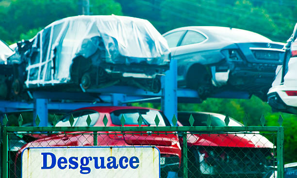 Scrapping sign in spanish language, car dismantling. Wrecked car junkyard. Galicia, Spain.