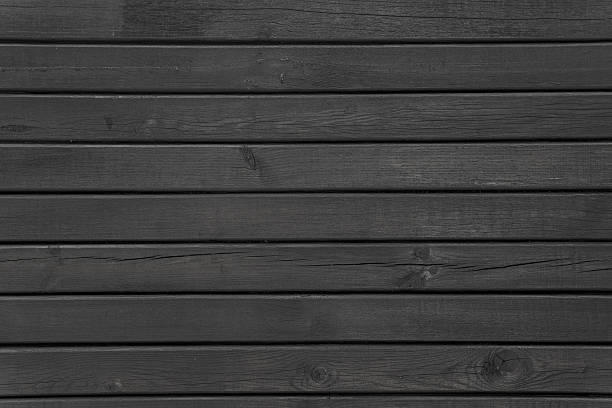 istock Black wooden planks arranged in horizontal rows. 2218130456