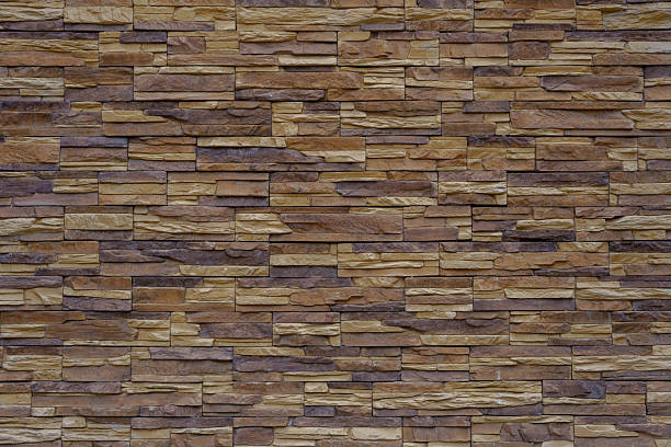 istock Wall made of brown and beige vintage bricks. 2218130505