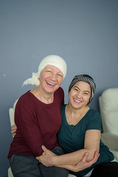 istock Women Embracing Each Other While Smiling in Supportive and Caring Moment 2218130811