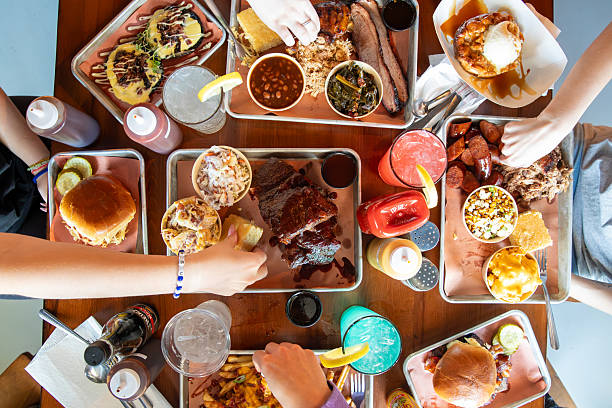 istock Friends eating at a Bbq restaurant 2218130853