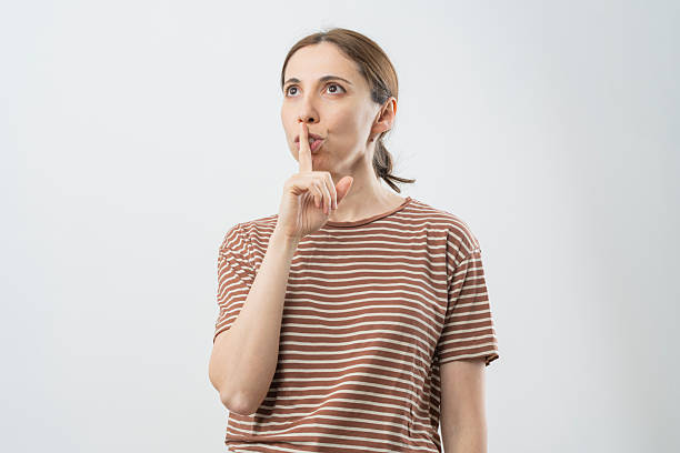 istock Silent sign woman isolated on white background 2218131211