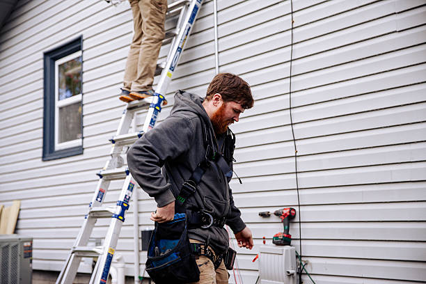 istock Electrician Wiring Up Solar Panel System on Home 2218135677