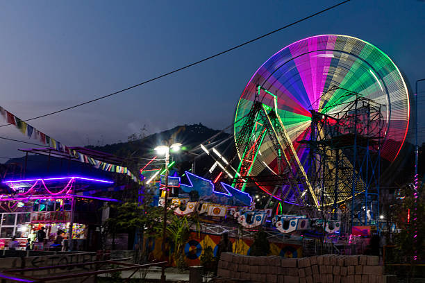 istock Ferris Wheel at Amusement Park at Dusk 2218137478