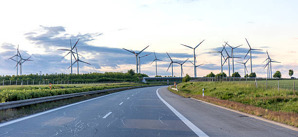 istock Highway and wind farm. Clean energy. Sustainable future. 2218139060