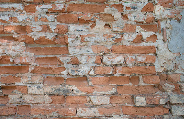 istock Aged Red and White Brick Wall, Weathered Texture and Mortar, Background 2218139690