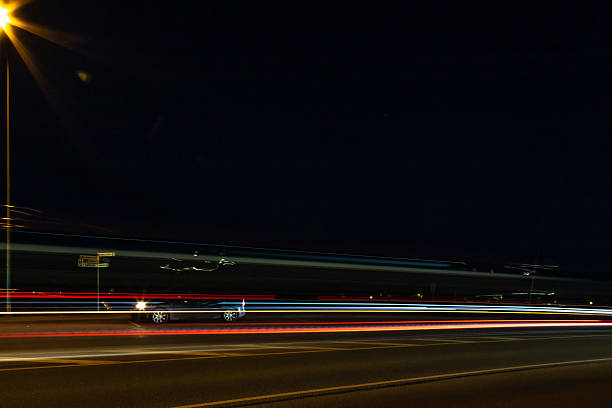 istock Night motorway transport light lines in city. Light traces Long time exposure dynamic photography. Blurred illuminated transport motion. 2218141232