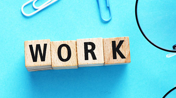 istock Word WORK arranged from wooden letters on blue background. Business concept. 2218141246