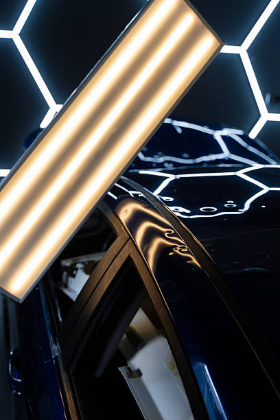 istock PDR lights reveal damage for accurate dent detection and assessment. Car panel shows multiple dents under PDR lighting, used in paintless dent repair to expose imperfections. 2218144691