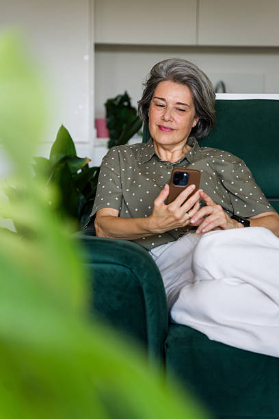 istock mature woman using smartphone 2218145177
