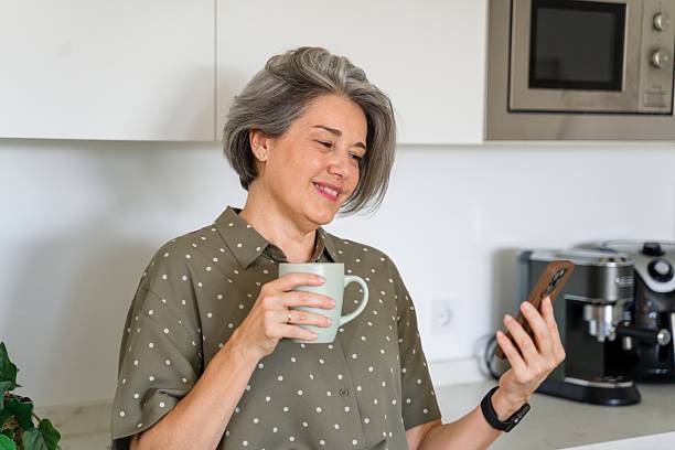 istock mature woman enjoying morning coffee 2218145246