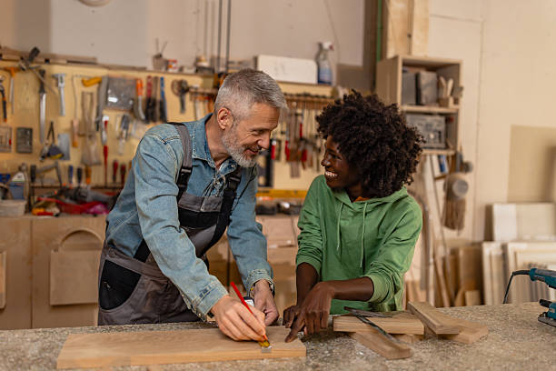 istock Mentoring in Woodworking with Smiles and Guidance 2218145324