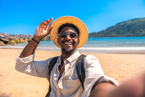 istock Tourist taking a selfie on a tropical beach 2218150613
