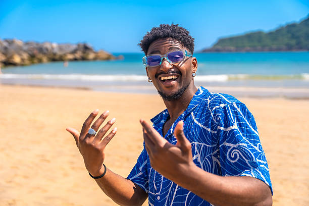 istock Young man enjoying summer vacation on a sunny beach 2218150652