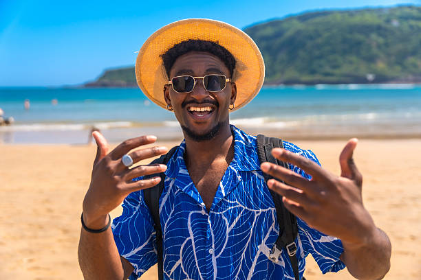 istock Happy tourist gesturing on a tropical beach 2218150654