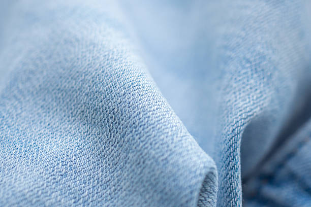 istock Old denim blue jeans fabric texture background close up 2218155271
