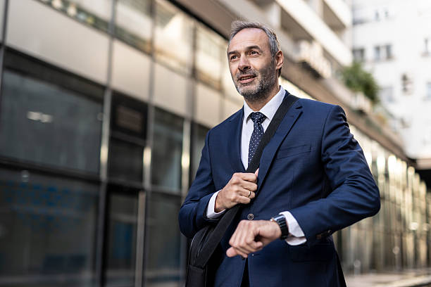 istock Smiling businessman gazing confidently at the environment. 2218155277