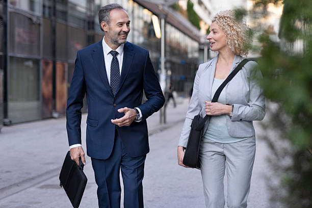 istock Business Professionals Engaging in Friendly Conversation 2218155304