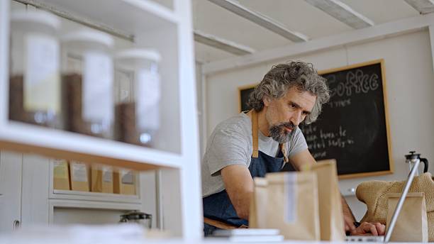 istock Zero Waste Coffee Shop. Barista Works On Laptop 2218155568