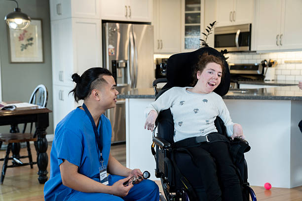 istock Caregiver Supporting a Smiling Woman in a Modern Home Environment 2218155783