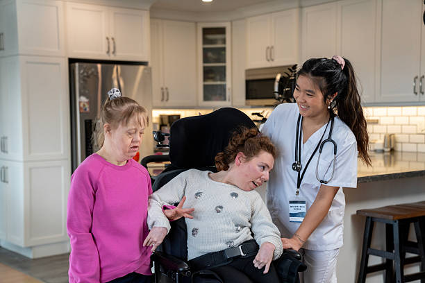 istock Caring Healthcare Professional Supporting Disabled Women in a Warm Home Setting 2218155842