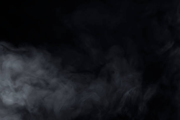 White cloud of smoke isolated on black background.