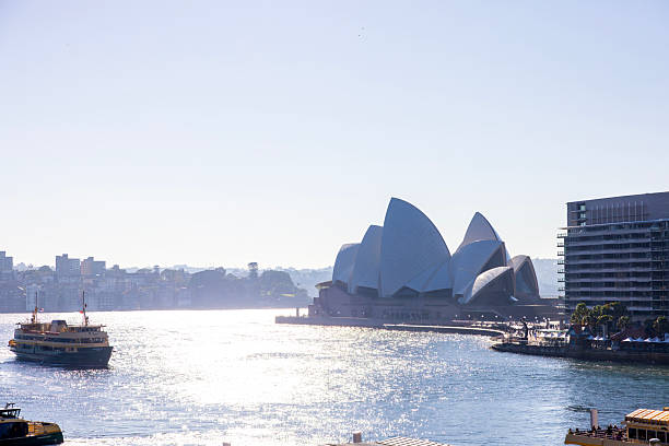 Sydney, Australia - June 01, 2025: Sydney Opera House in morning sun, Sydney's Opera House is a UNESCO World Heritage site