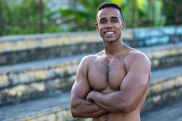 istock Shirtless muscular athlete smiling with folded arms 2218158673