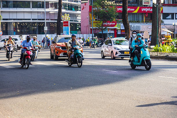 Ho Chi Minh city, Vietnam, April 23rd, 2025. Morning rush hour with commuters in scooters, downtown Ho Chi Minh City, as seen in the Turtle Pond roundabout