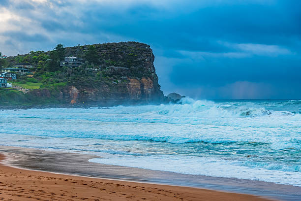 istock Moody sunrise with waves at the seaside 2218161698