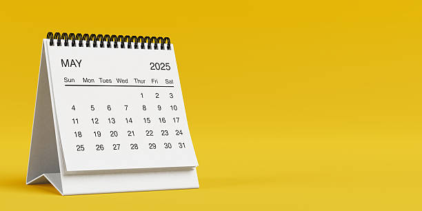 istock White Desk Monthly May 2025 Business Calendar. 3d Rendering 2218163769