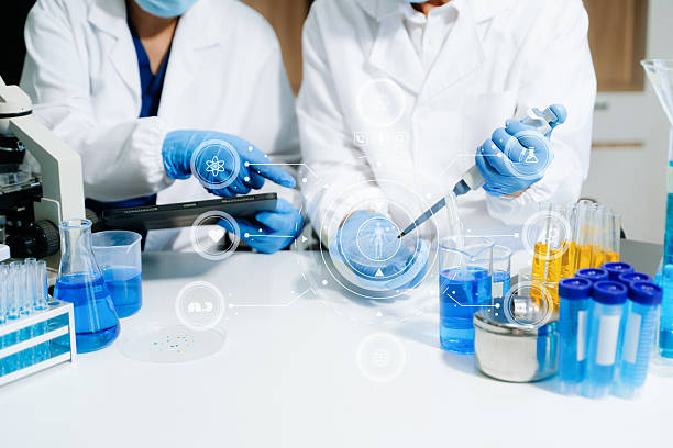 istock Modern medical research laboratory. female scientist hands working with micro pipettes analyzing biochemical samples 2218166699