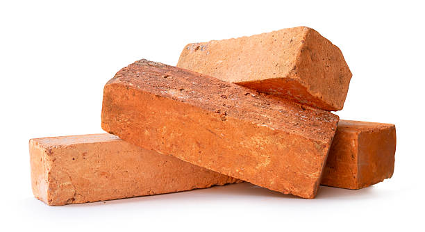 istock Side view of four cracked old red or orange bricks in stack isolated on white background with clipping path 2218167671