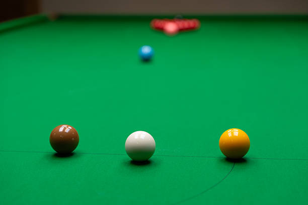 istock Snooker balls arranged on a green table under soft lighting 2218167824
