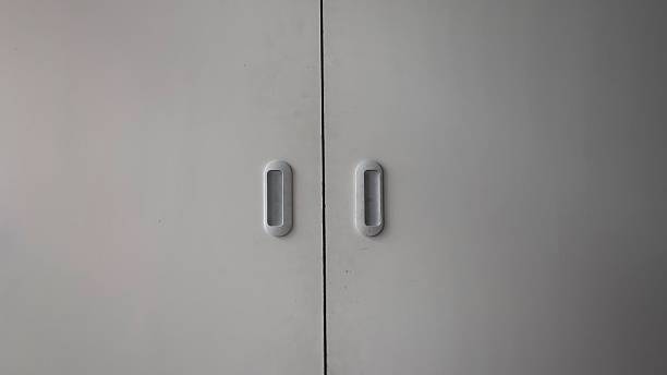 istock A pair of white cabinet doors with simple handles 2218168764