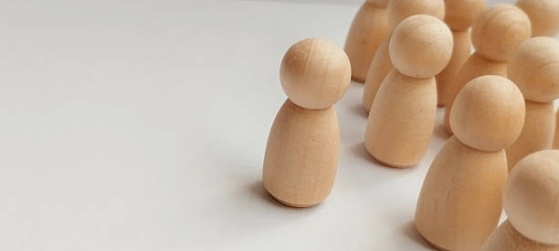 istock Leadership dynamics wooden figurines representing group behavior studio photography neutral background conceptual focus 2218169408