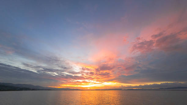 istock Colorful Sunset Sky Over Calm Water 2218172445