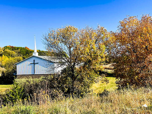 Rural scene from Norman Rockwell's former home of the village church, covered bridge and community center where dances or events are held, Arlington, Vermont, USA
