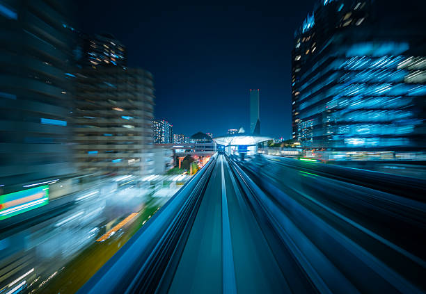 istock Yurikamome Monorail Approaching Station in Tokyo at Night 2218177183