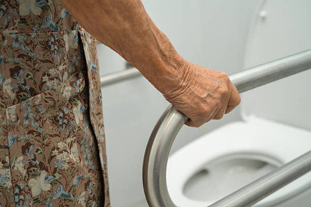 istock Asian elderly woman patient use toilet support rail in bathroom. 2218177633