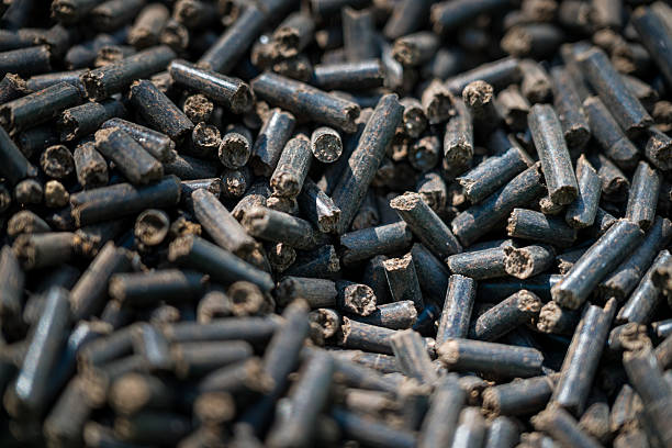 istock Organic soil fertiliser. Preparing soil for planting, fertilizing with compressed chicken manure pellets. Eco friendly gardening. 2218184755