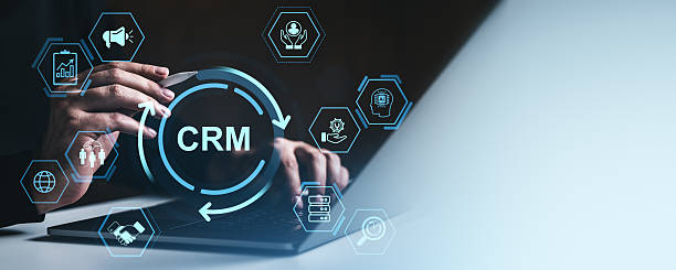 istock CRM system interface concept with digital marketing and customer data icons over businessman's hands using laptop and stylus in modern workspace.. 2218186757