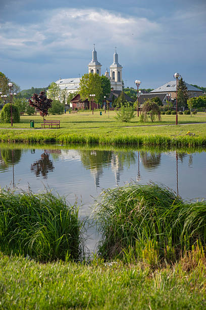 Modern residential buildings skyline near lake in autumn park