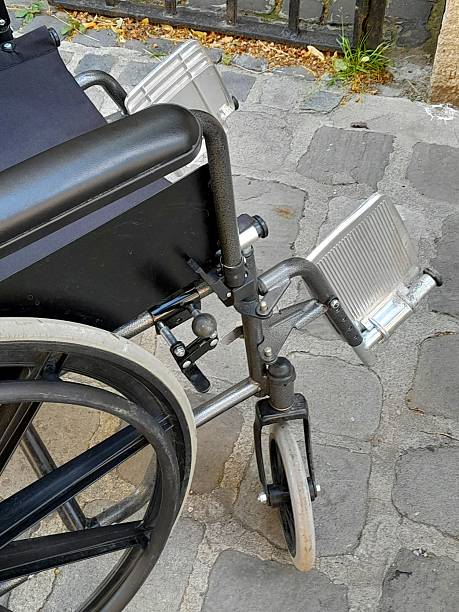 istock Wheelchair on cobblestone close up 2218190299