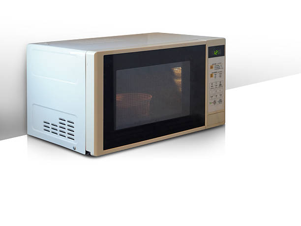 istock side view old white and black microwave oven placed on white floor, white wall background, technology, object, ferniture, copy space 2218191907
