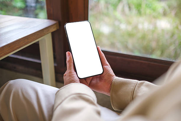 istock Mockup image of a woman holding mobile phone with blank screen 2218194865