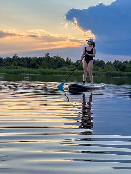 istock Paddleboarding at Sunset on a Tranquil Lake 2218197711