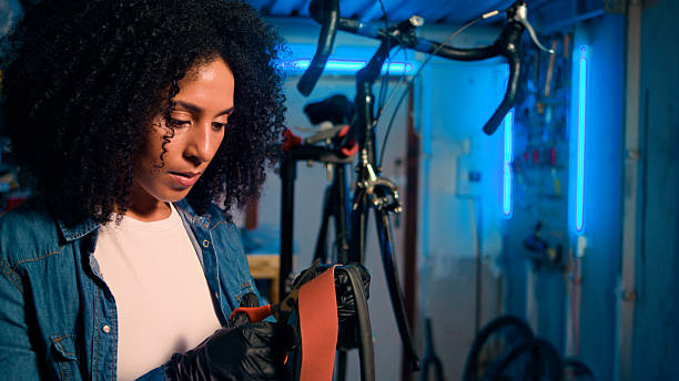 istock Female Bicycle Mechanic in Workshop Working on Bike Handlebars 2218198878